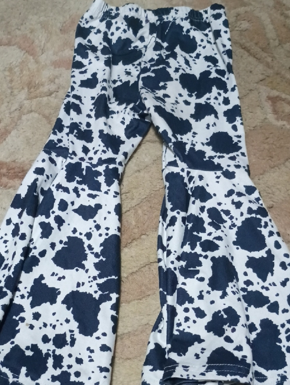 Black and White Cow Print Flared Leggings